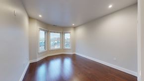 San Francisco apartment for rent - A room with a wooden floor and white walls.