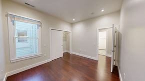 San Francisco apartment for rent - A room with a window and wooden floors.