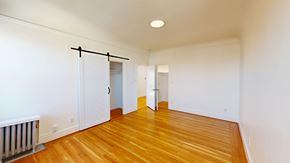 San Francisco apartment for rent - A room with wooden floors and white walls.