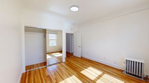 San Francisco apartment for rent - A room with a wooden floor and a white wall.