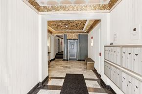 San Francisco apartment for rent - A hallway with a bench and a door at the end.