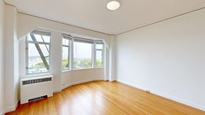 San Francisco apartment for rent - A room with a white wall and a wooden floor.