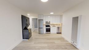 Berkeley apartment for rent - A kitchen area with a refrigerator, oven, and microwave.