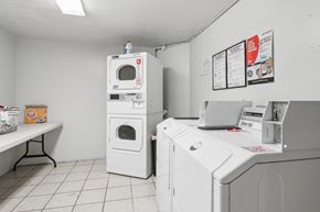 San Francisco apartment for rent - Laundry room with washing machines neatly arranged on a wooden floor