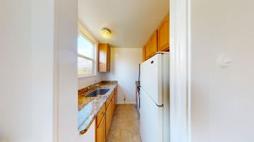 Berkeley apartment for rent - A kitchen with a sink and refrigerator.