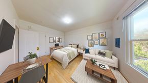 Berkeley apartment for rent - A well-lit, modern bedroom with a large bed and a couch.