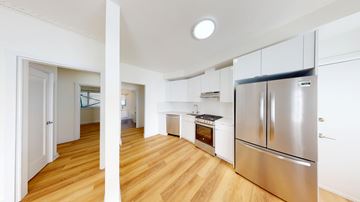 Berkeley apartment for rent - A kitchen with a refrigerator and an oven.