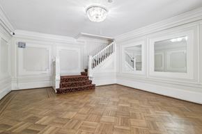 San Francisco apartment for rent - A room with a staircase and a chandelier.