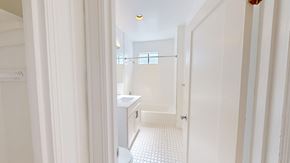 San Francisco apartment for rent - A white bathroom with a toilet, sink, and shower.