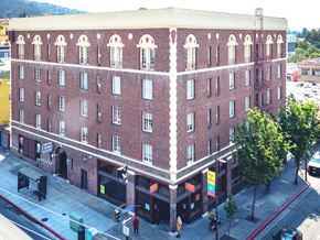 Berkeley apartment for rent - A red brick building with a white trim around the windows and roofline.