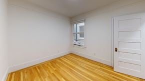 Berkeley apartment for rent - A room with wooden flooring and a white door.