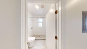 Berkeley apartment for rent - A white bathroom with a toilet, sink, and shower.