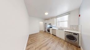 Berkeley apartment for rent - A kitchen with a washing machine built into the counter.