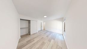 Berkeley apartment for rent - A room with wooden flooring and white walls.