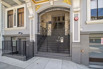 San Francisco apartment for rent - A black wrought iron gate blocks the entrance to a building.