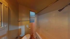 Berkeley apartment for rent - A bathroom with a toilet, sink, and bathtub.