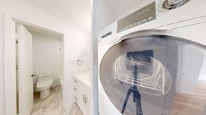 Berkeley apartment for rent - A white bathroom with a toilet and sink.