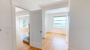 San Francisco apartment for rent - A white door is open to a room with a wooden floor.