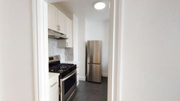 San Francisco apartment for rent - A kitchen with a stove and a refrigerator.