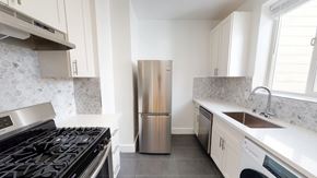 San Francisco apartment for rent - A kitchen with a stove, refrigerator, and washing machine.