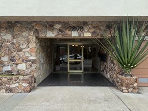 San Francisco apartment for rent - A stone archway with the number 2608 above it.