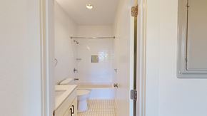 San Francisco apartment for rent - A white bathroom with a toilet, sink, and shower.