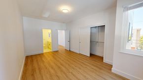 San Francisco apartment for rent - A room with wooden floors and white walls.