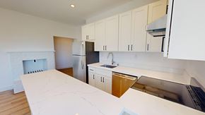 San Francisco apartment for rent - A kitchen with white cabinets and a white counter top.
