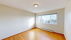 San Francisco apartment for rent - A room with a window and a radiator on the wall.