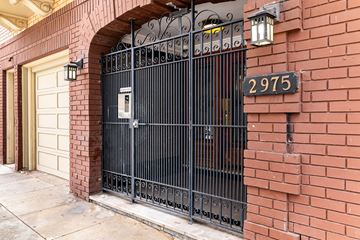 San Francisco apartment for rent - A black wrought iron gate with a mailbox on it.