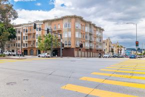 San Francisco apartment for rent - A street view of a crosswalk with a building in the background.