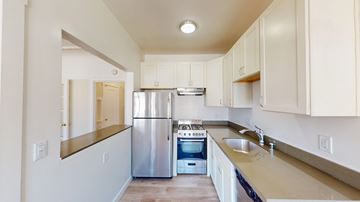 San Francisco apartment for rent - A kitchen with a stainless steel refrigerator and oven.