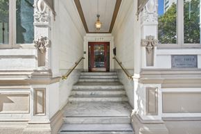 San Francisco apartment for rent - A white building with a red door and a sign that says "FUJI LARKIN".