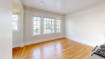 San Francisco apartment for rent - A room with wooden floors and a window.