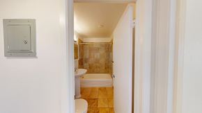 San Francisco apartment for rent - A bathroom with a toilet, sink and bathtub.