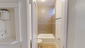 San Francisco apartment for rent - A white bathroom with a toilet, sink, and shower.