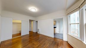 San Francisco apartment for rent - A room with wooden floors and white walls.