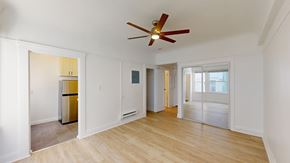 San Francisco apartment for rent - A room with a ceiling fan and wooden flooring.