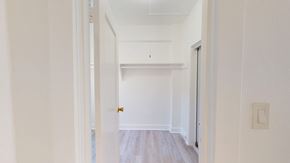 San Francisco apartment for rent - A white hallway with a door on the right.