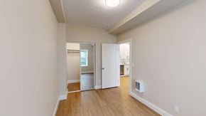 San Francisco apartment for rent - A room with a white door and a window.