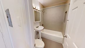San Francisco apartment for rent - A white bathroom with a toilet, sink, and bathtub.