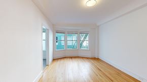 San Francisco apartment for rent - A room with wooden floors and white walls.