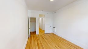 San Francisco apartment for rent - A room with a wooden floor and white walls.