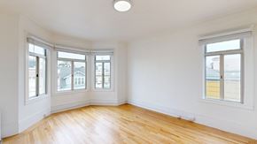 San Francisco apartment for rent - A room with wooden floors and white walls.