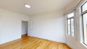 San Francisco apartment for rent - A room with wooden floors and white walls.