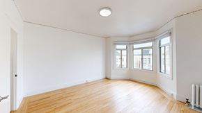 San Francisco apartment for rent - Empty room with wooden floor and white walls.