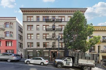 San Francisco apartment for rent - A white car is parked in front of a building.