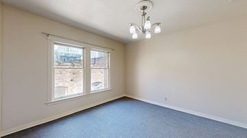 San Francisco apartment for rent - A room with a window overlooking a construction site.