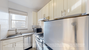 San Francisco apartment for rent - A modern kitchen with a stainless steel refrigerator, sink, and cabinets.