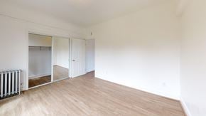San Francisco apartment for rent - A room with a wooden floor and white walls.